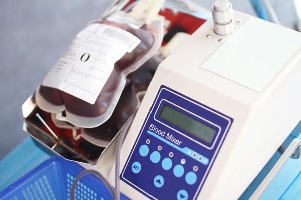 Photo of blood plasma bags being analyzed on HemaControl equipment.