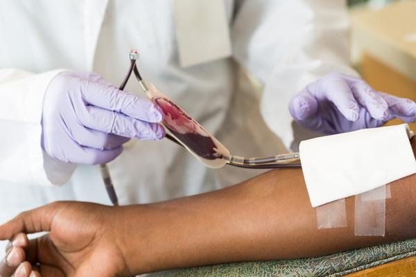 Photo of blood being drawn from arm.
