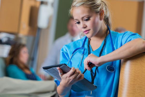 Photo of hospital staffer using tablet.