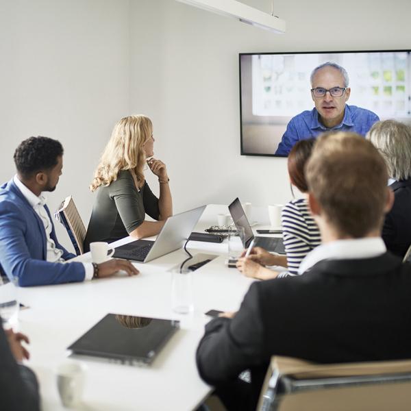 Team in boardroom meeting.